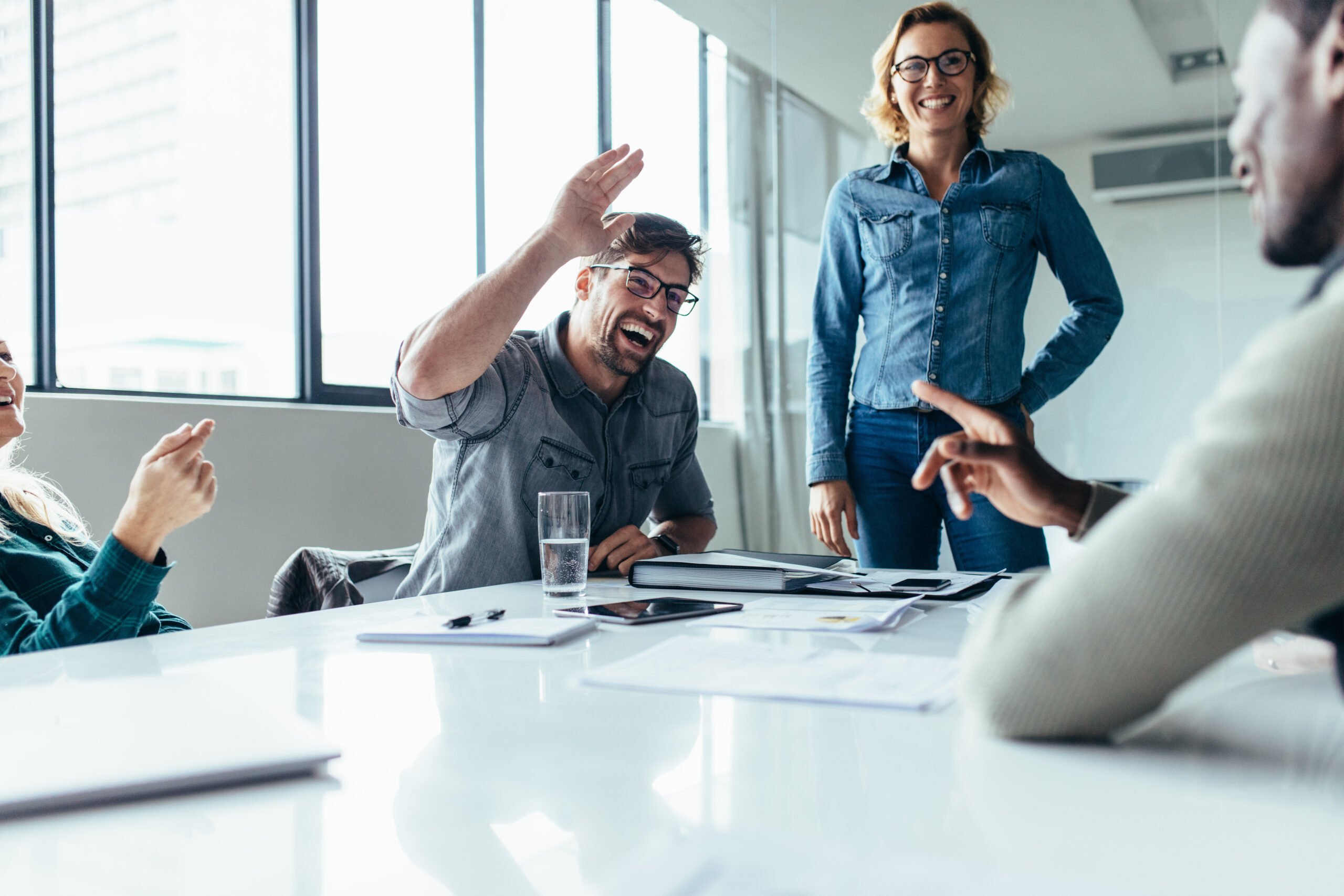 Businessman,Offering,A,High,Five,To,A,Coworker,During,A